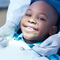 child smiling during dental checkup