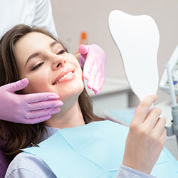 A patient receiving care from a cosmetic dentist in Midwest City