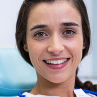 young woman smiling in dental office