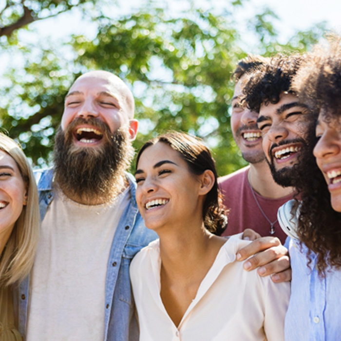Smiling Midwest City patient laughing with friends