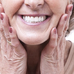 Woman smiling with dentures in Midwest City