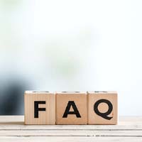 Wooden letter blocks on ledge spelling FAQ