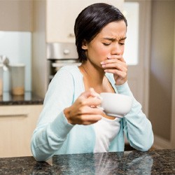 woman coffee toothache for root canal therapy in Midwest City 