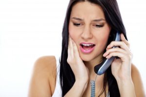 woman on phone dental emergency