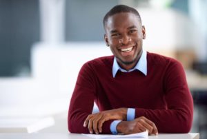 a man with a beautiful smile at work