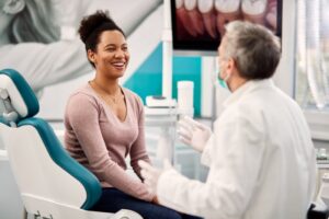 Woman smiling after her routine dental checkup