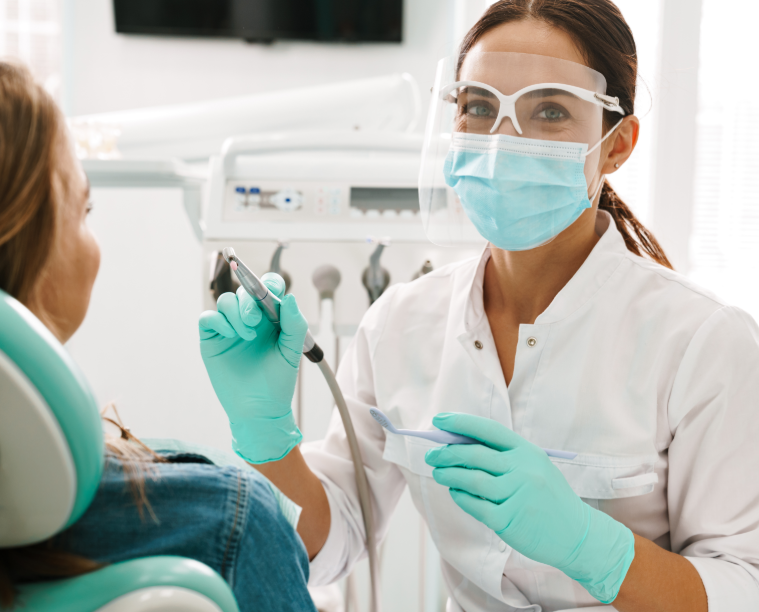 Dentist with patient in chair